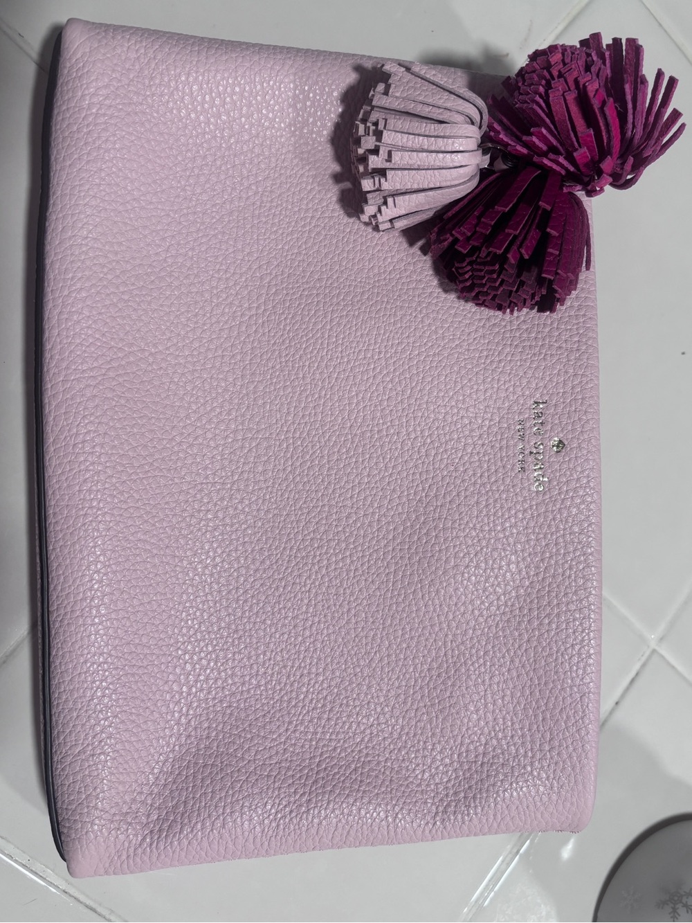 Like new Kate Spade pink pebbled leather clutch with tassels